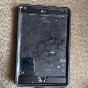Apple IPad Mini with black otter box case